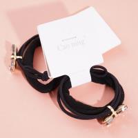 2 bow tie diamond boxes containing headbands and rubber bands