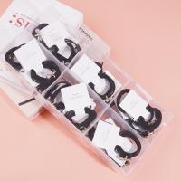 2 bow tie diamond boxes containing headbands and rubber bands