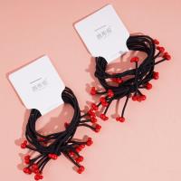 3 pieces of rubber bands with bear heads and small red beads at the ends