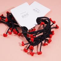 3 pieces of rubber bands with bear heads and small red beads at the ends