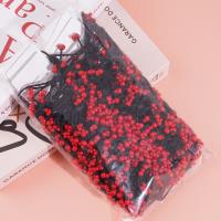 3 pieces of rubber bands with bear heads and small red beads at the ends