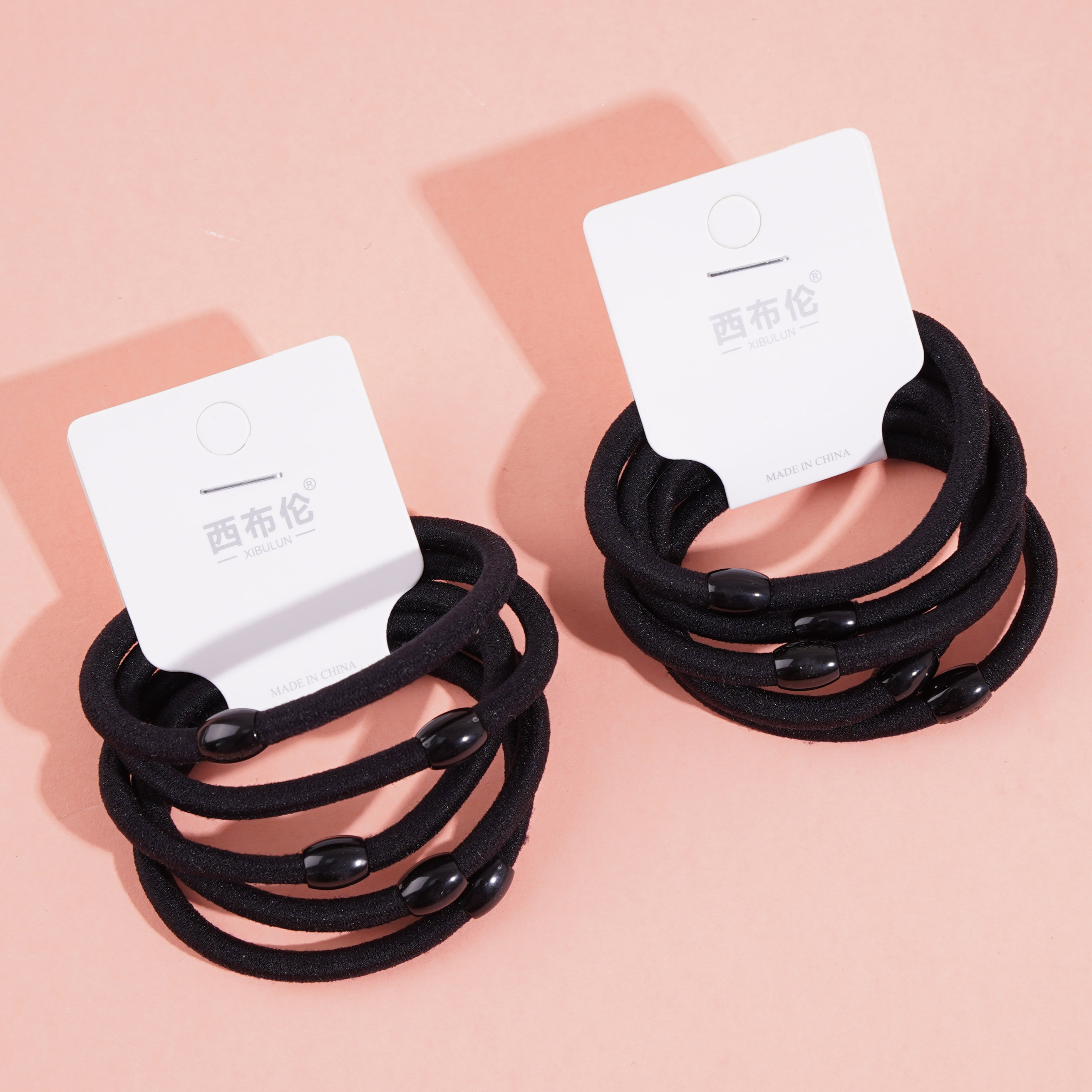 5 small black bead headbands with elastic bands