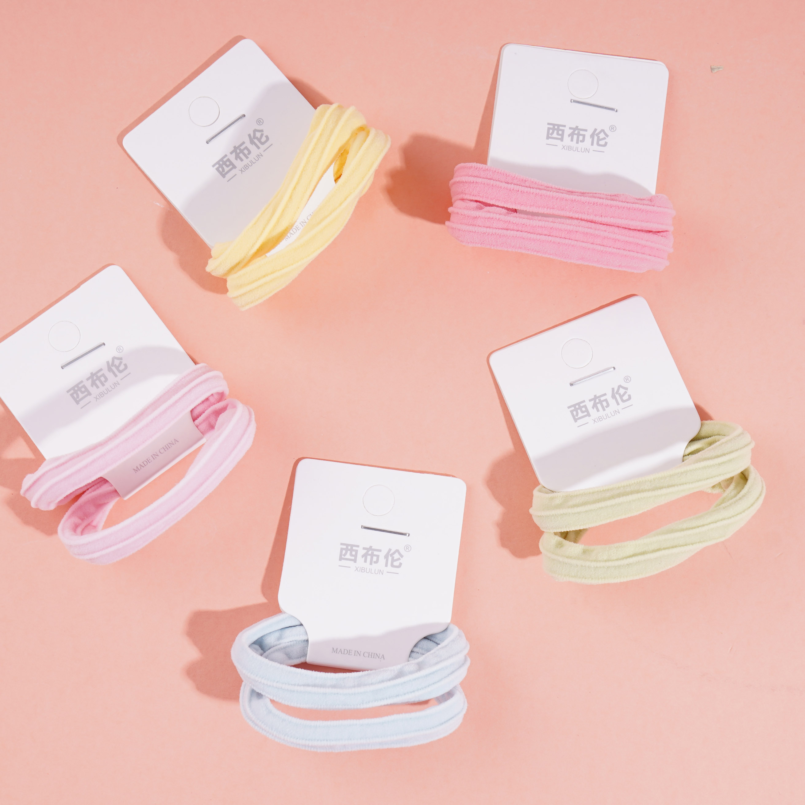 2 colorful striped towel loop head ropes and rubber bands