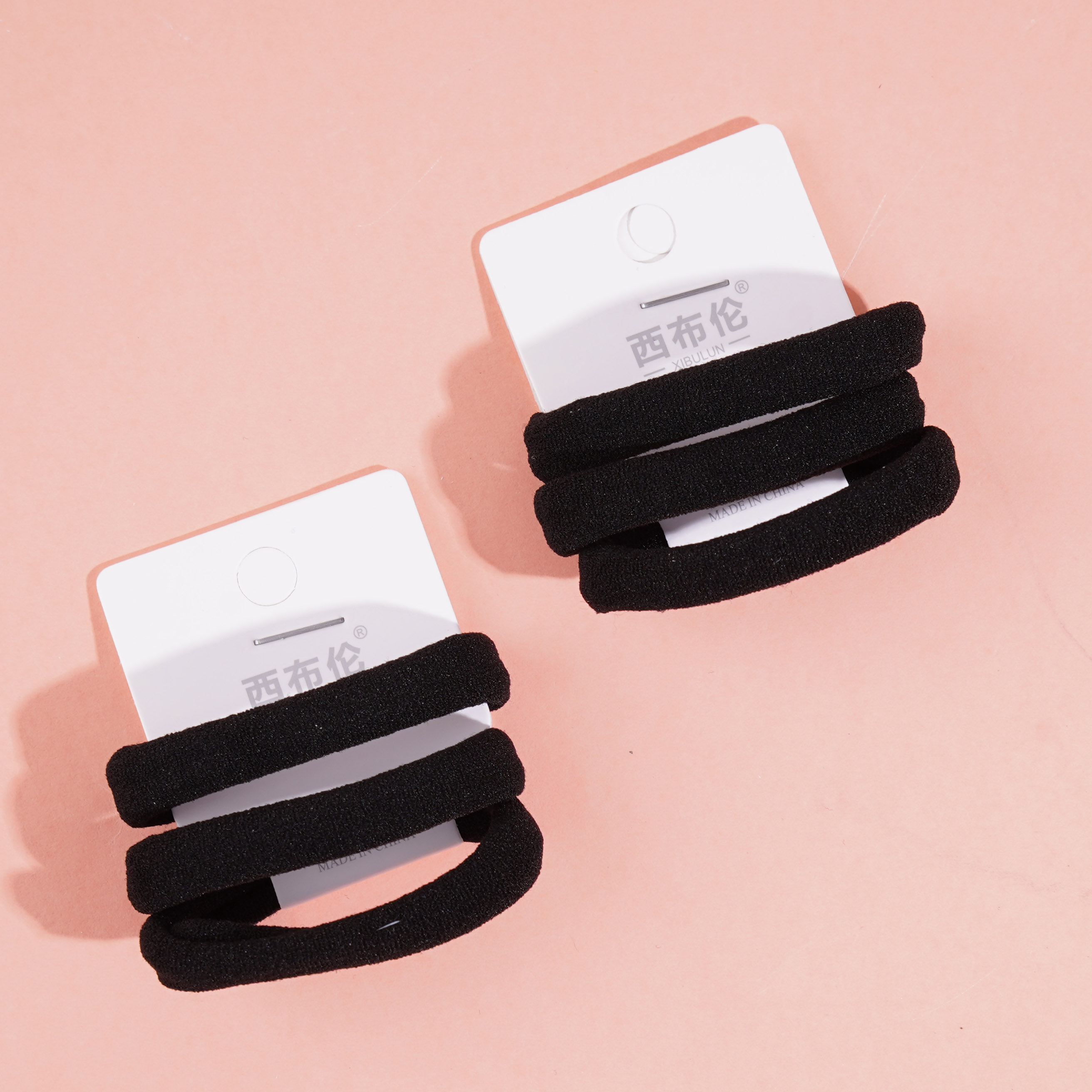 3 black towel loop-headed ropes and rubber bands