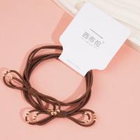 2 gold bead-decorated string elastics