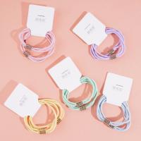 2 colorful square diamond-shaped rubber bands