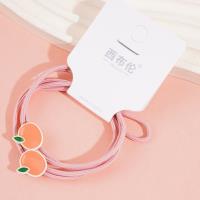 2 colorful fruit-themed rubber bands for hair ties