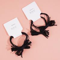 2 cordes à nouer noires avec des embouts en cuir et des élastiques.