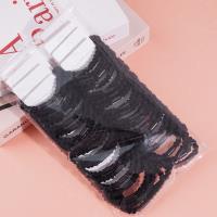 2 black ponytail elastics with a bow-shaped design