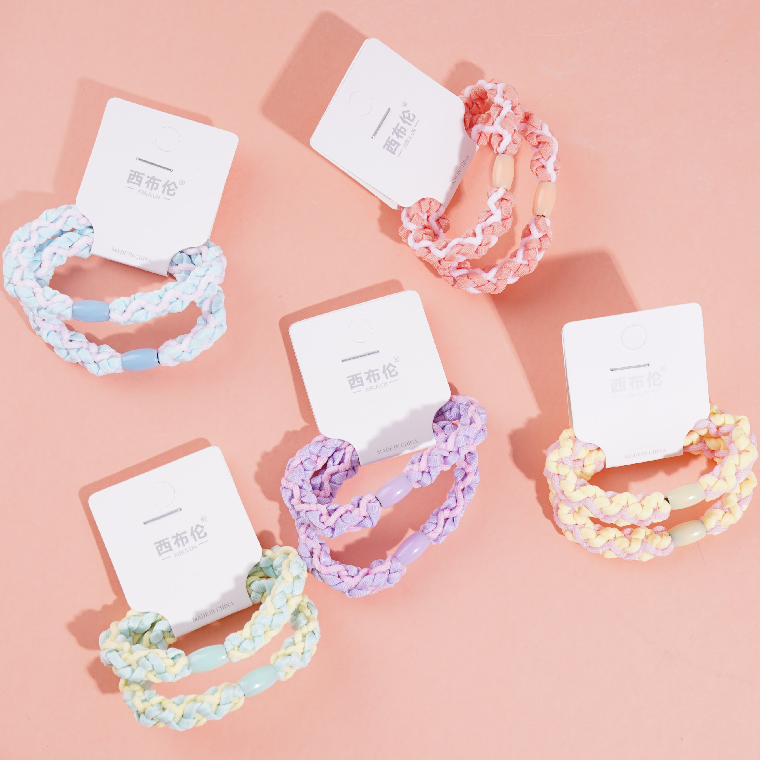 2 woven colorful headbands and rubber bands