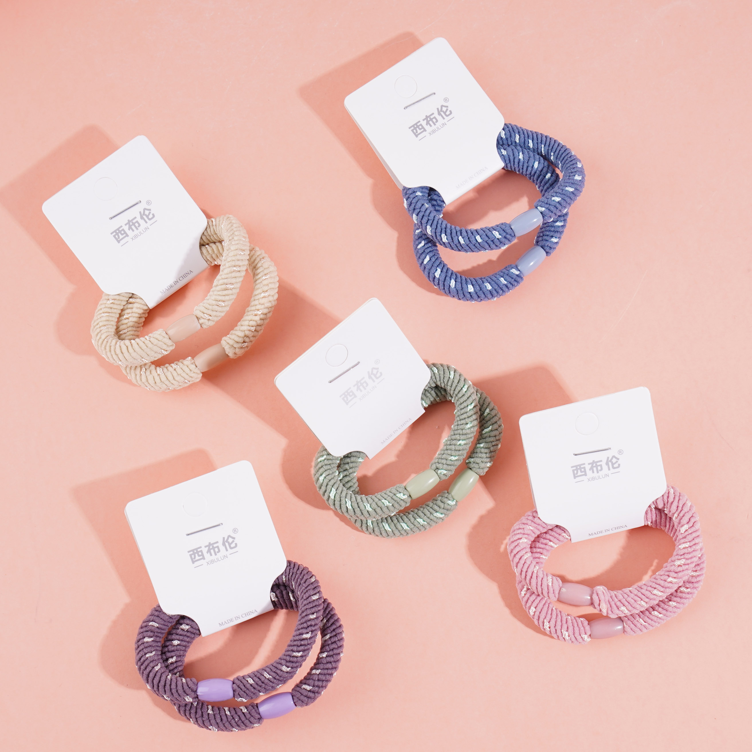 2 pieces of fluffy cord with elastic bands