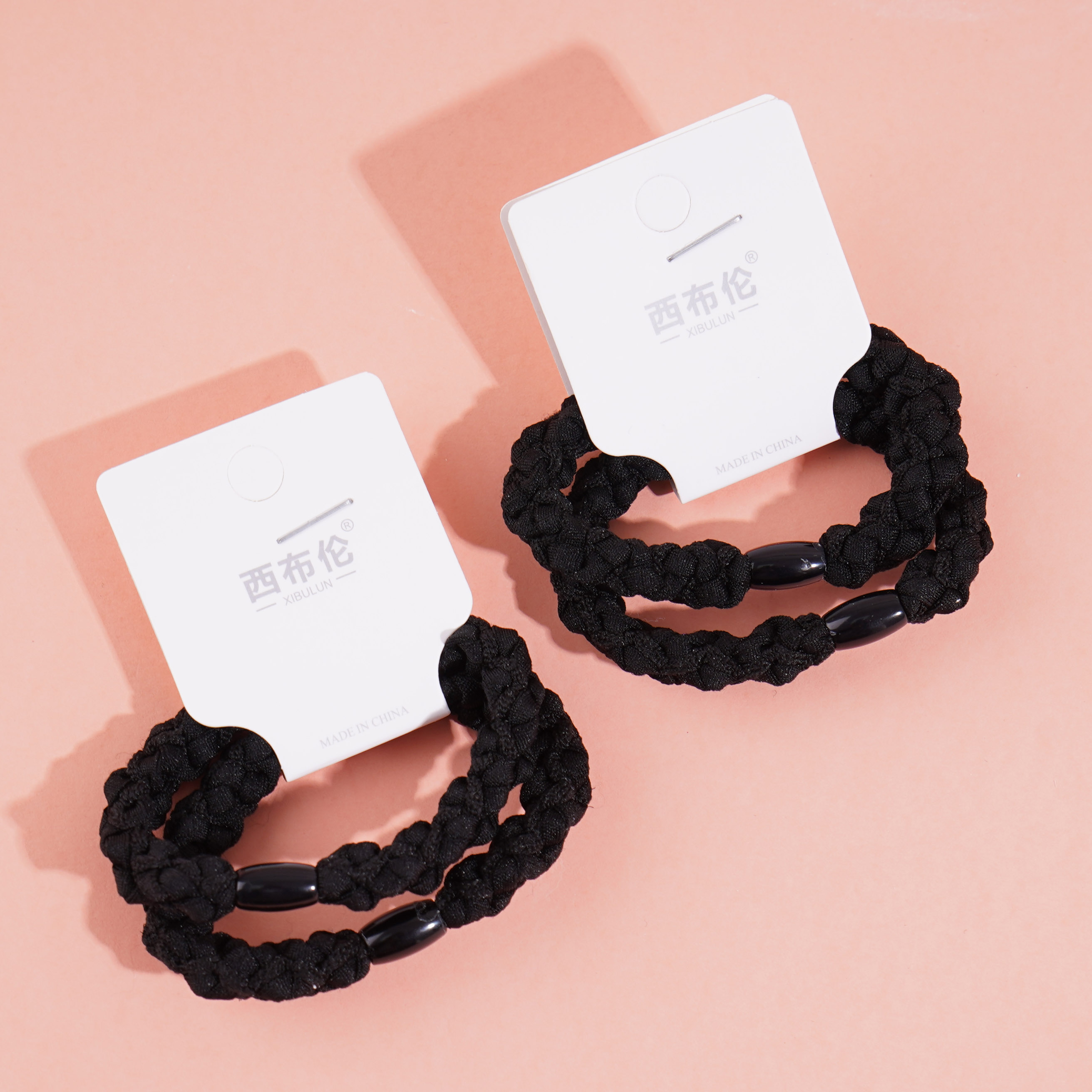 2 round braided headbands with elastic bands