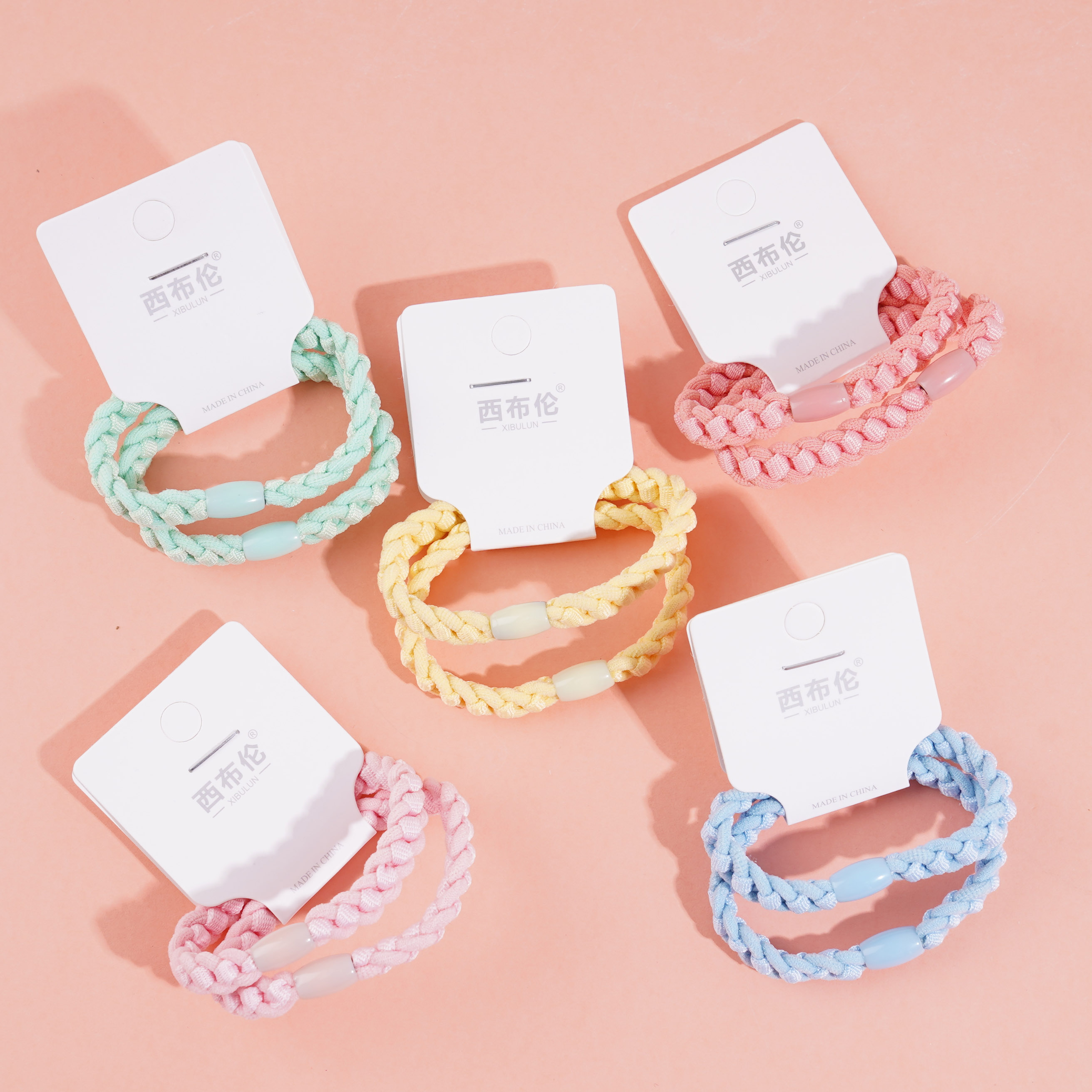 2 colorful flat-woven headbands with elastic bands