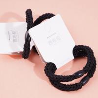 2 black flat beads with thickened heads and rubber bands