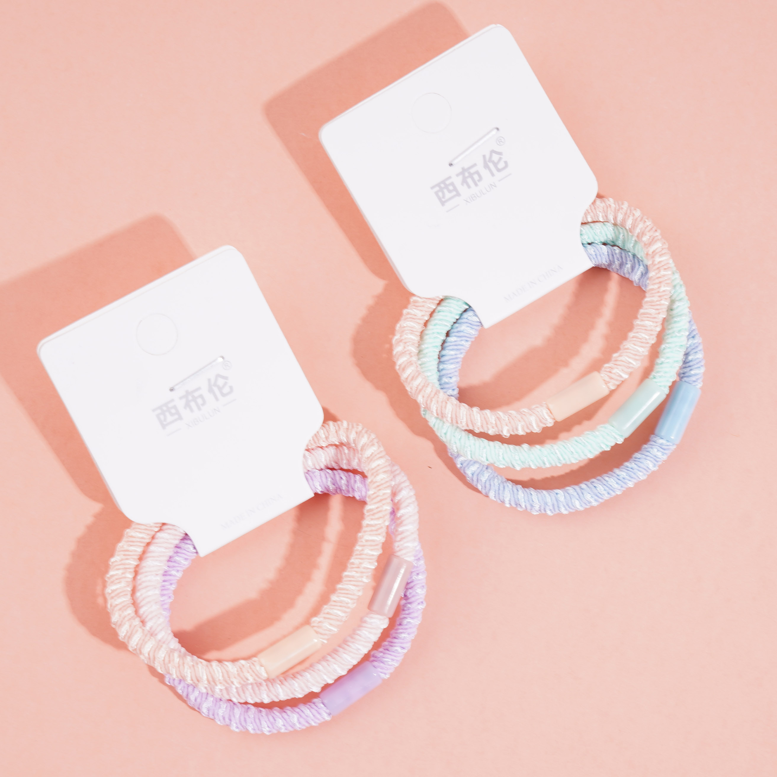 3 colorful dotted headbands and rubber bands