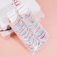 3 colorful dotted headbands and rubber bands