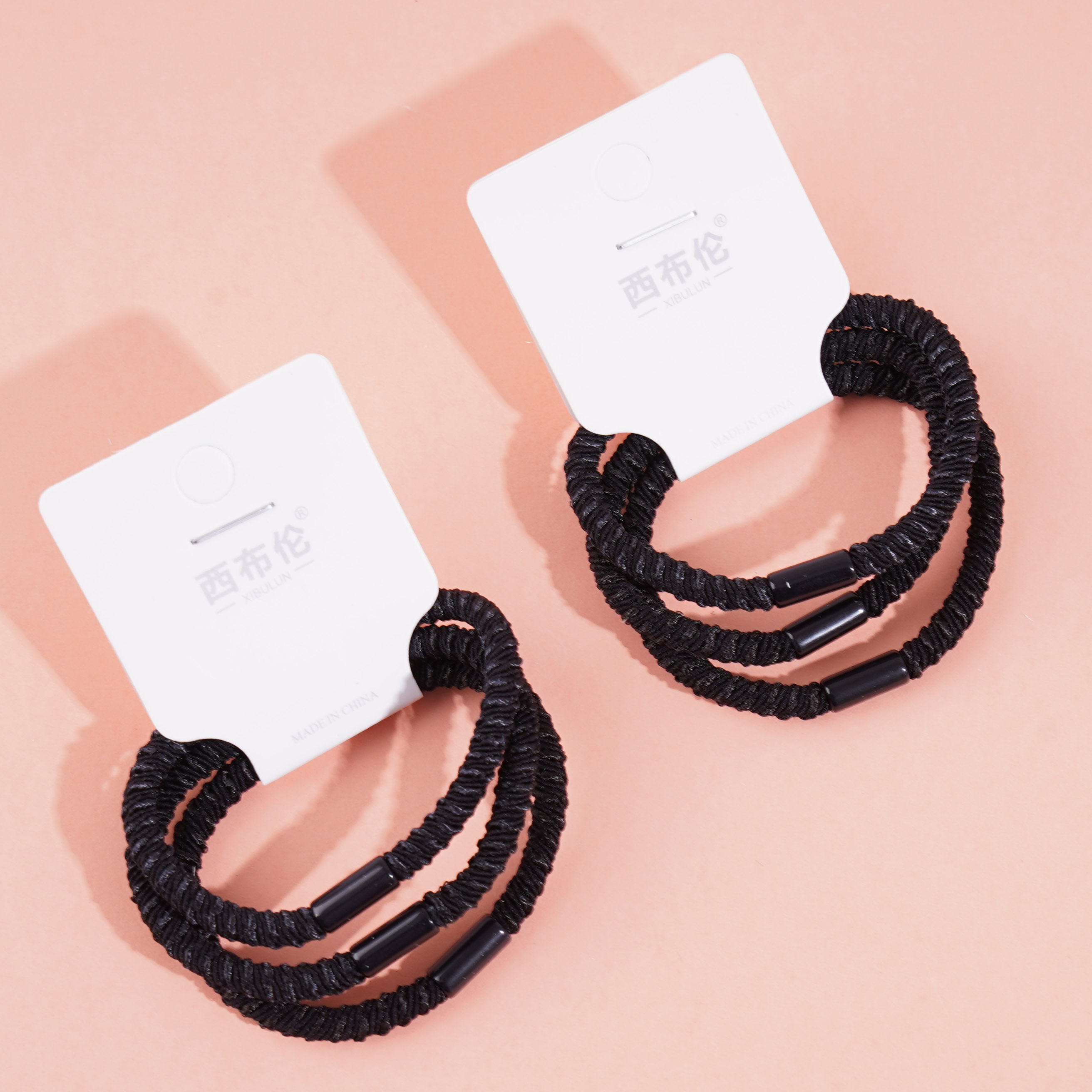 3 black dotted headbands with elastic bands