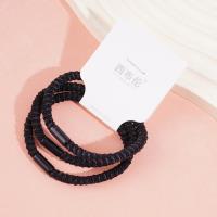 3 black dotted headbands with elastic bands