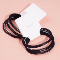 3 black letter-headed rubber bands