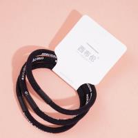 3 black letter-headed rubber bands