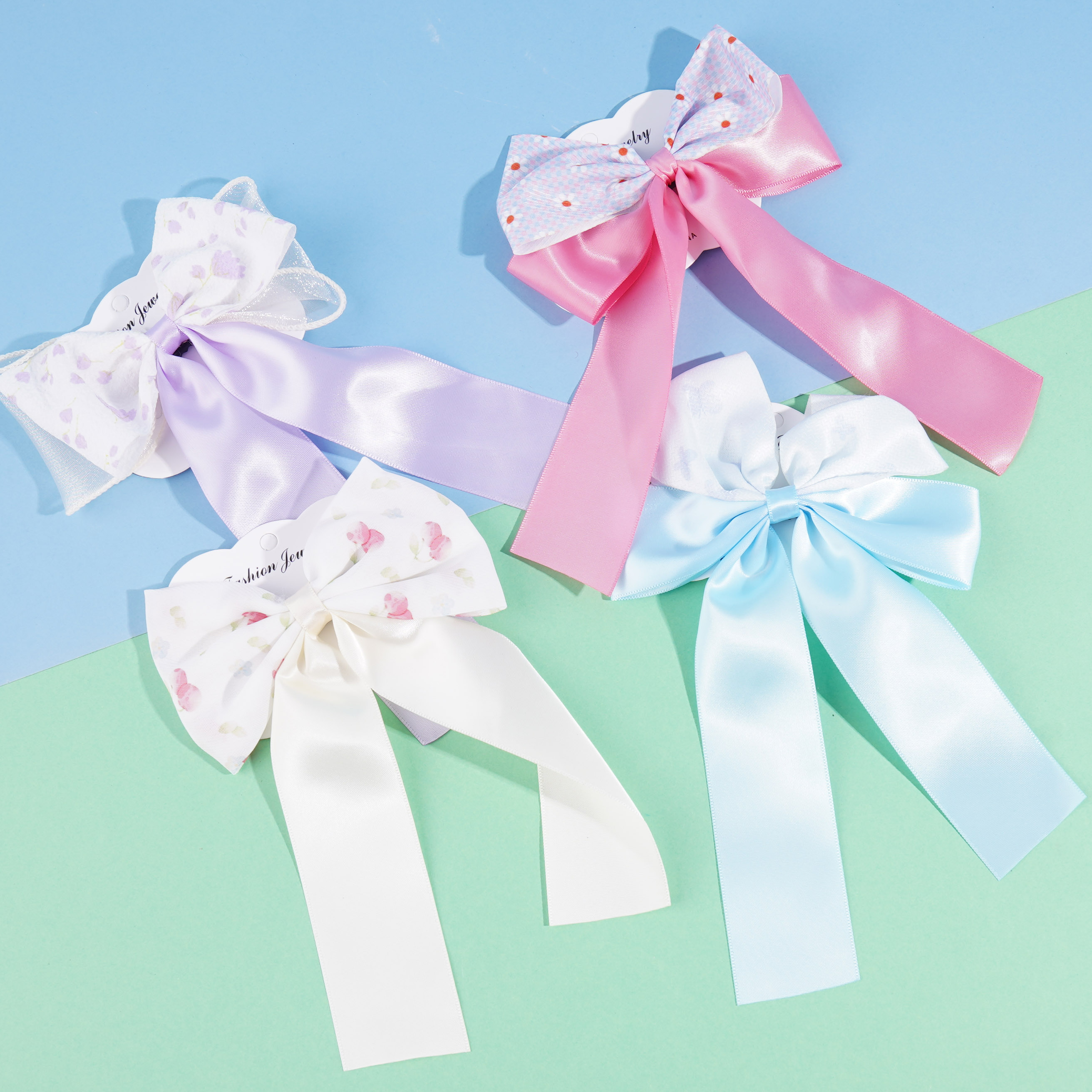 A variety of multi-color bow tie duck clips