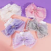 Pearlescent MIU bow tie duck clip