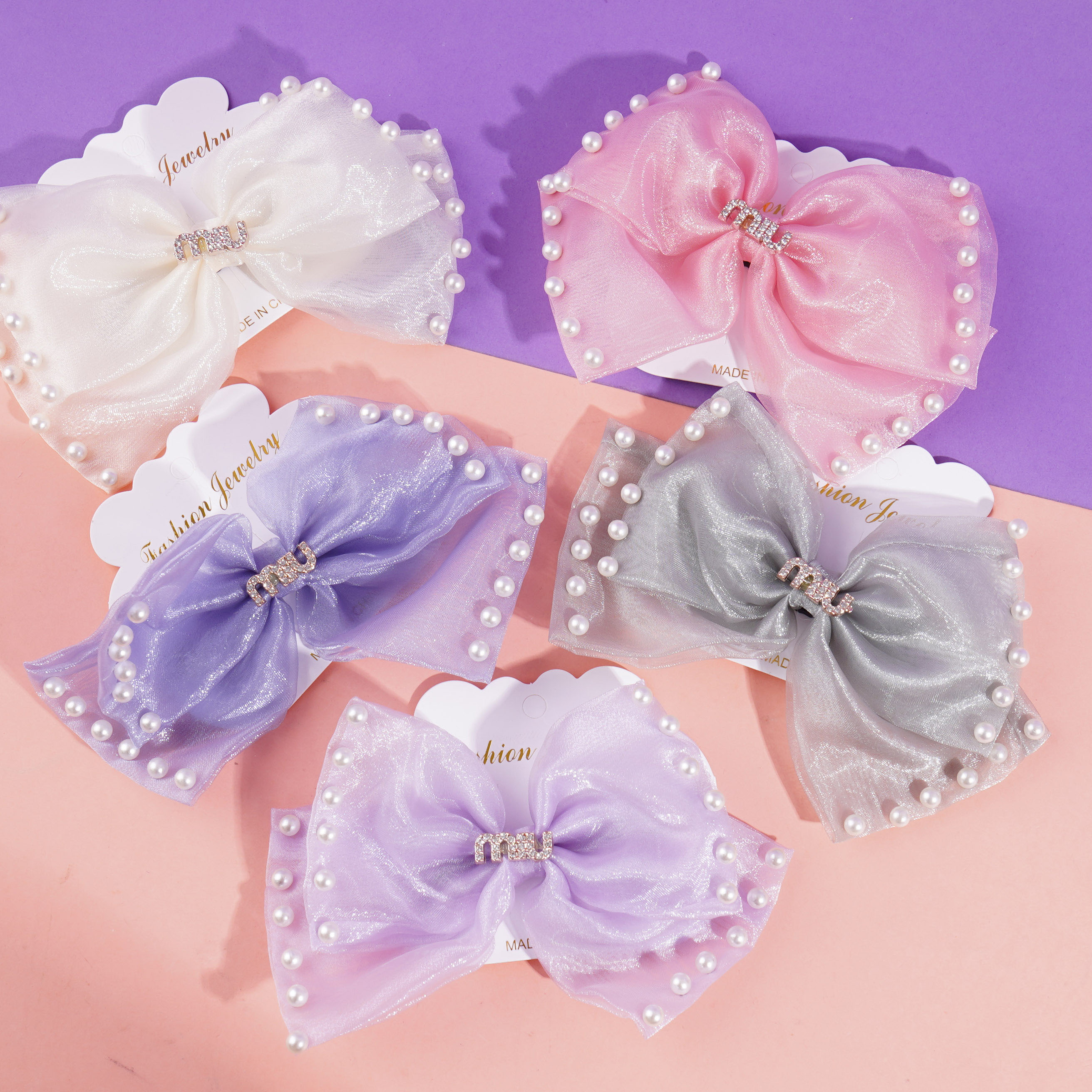 Pearlescent MIU bow tie duck clip