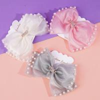 Pearlescent MIU bow tie duck clip