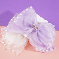 Pearlescent MIU bow tie duck clip