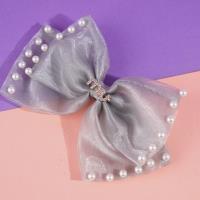 Pearlescent MIU bow tie duck clip