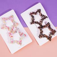 مشبك BB على شكل نجمة خماسية بألماس ملون.