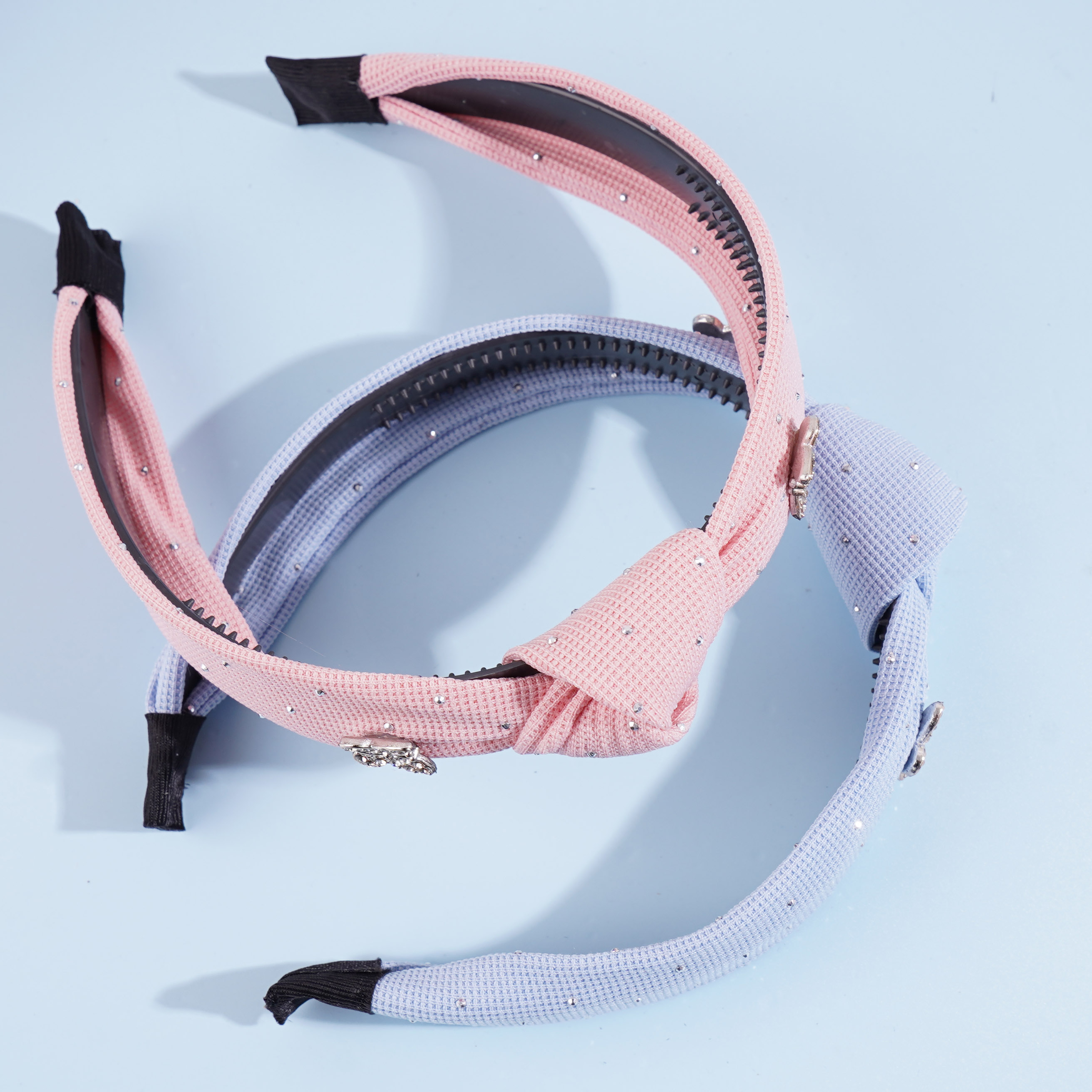 A double butterfly full-diamond knotted headband hair clip