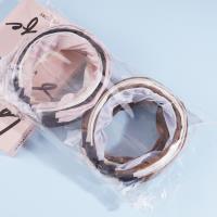 A knotted lace headband with dots and a bow decoration