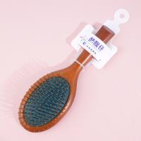 Une brosse à air pneumatique de couleur marron-vert de forme ovale, modèle 3338 .