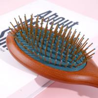 Une brosse à air pneumatique de couleur marron-vert de forme ovale, modèle 3338 .