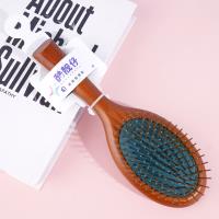Une brosse à air pneumatique de couleur marron-vert de forme ovale, modèle 3338 .