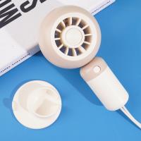 The YM88218 cream-colored pop-up fan with a lanyard-equipped base