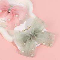 Glitter and beaded bow tie duck clip