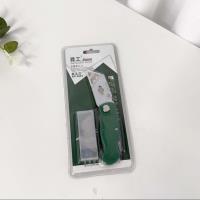 Premium green-handled folding art knife