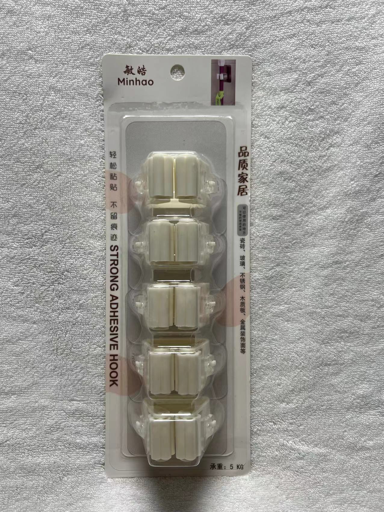 1 box of MHGG32511 mop clamp and adhesive hooks, containing 24 pieces.