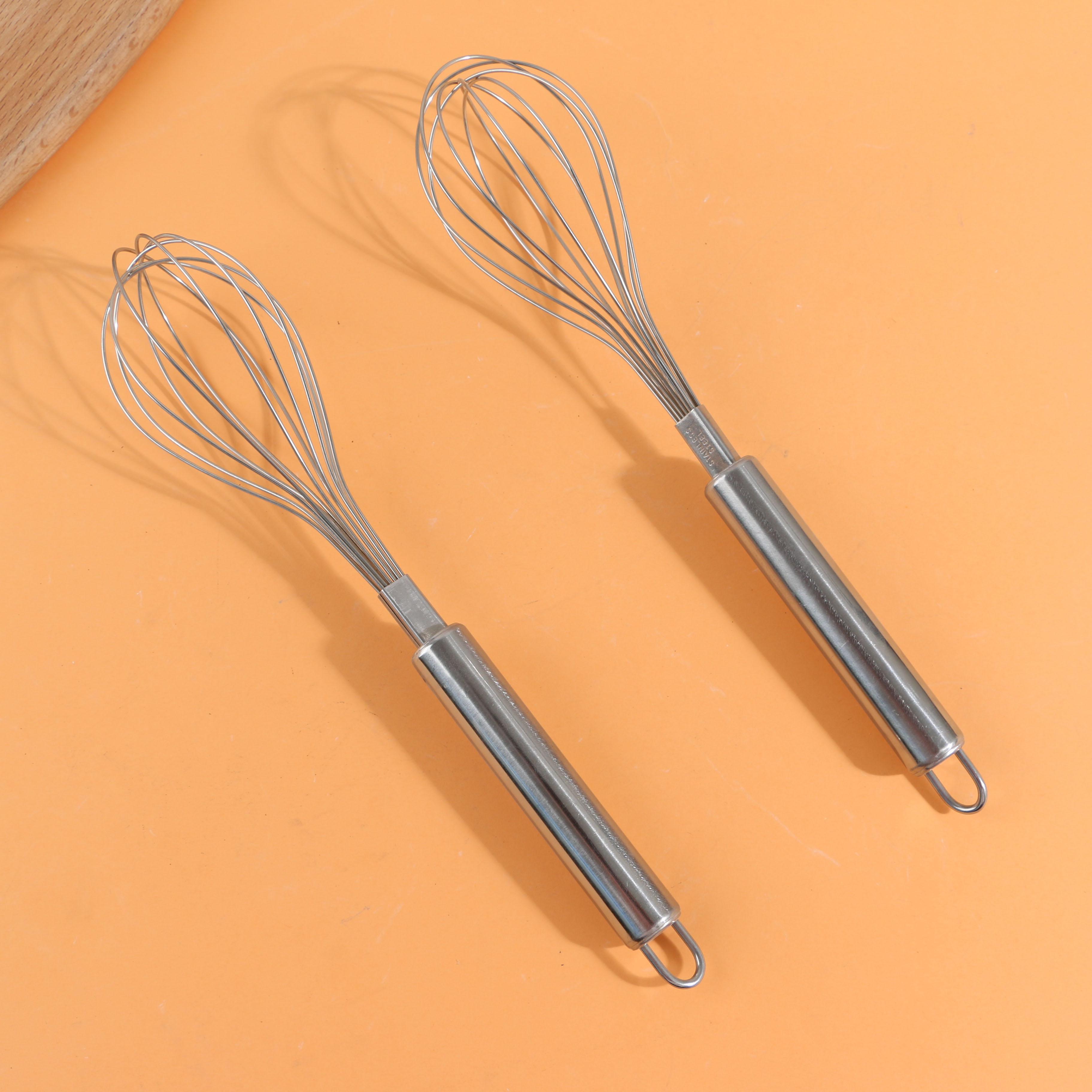 Large egg beater with a round handle