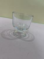 The can-opener blows water into the cup