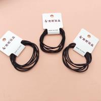 3 black simple hair ties in the style of "Woodland Girl"