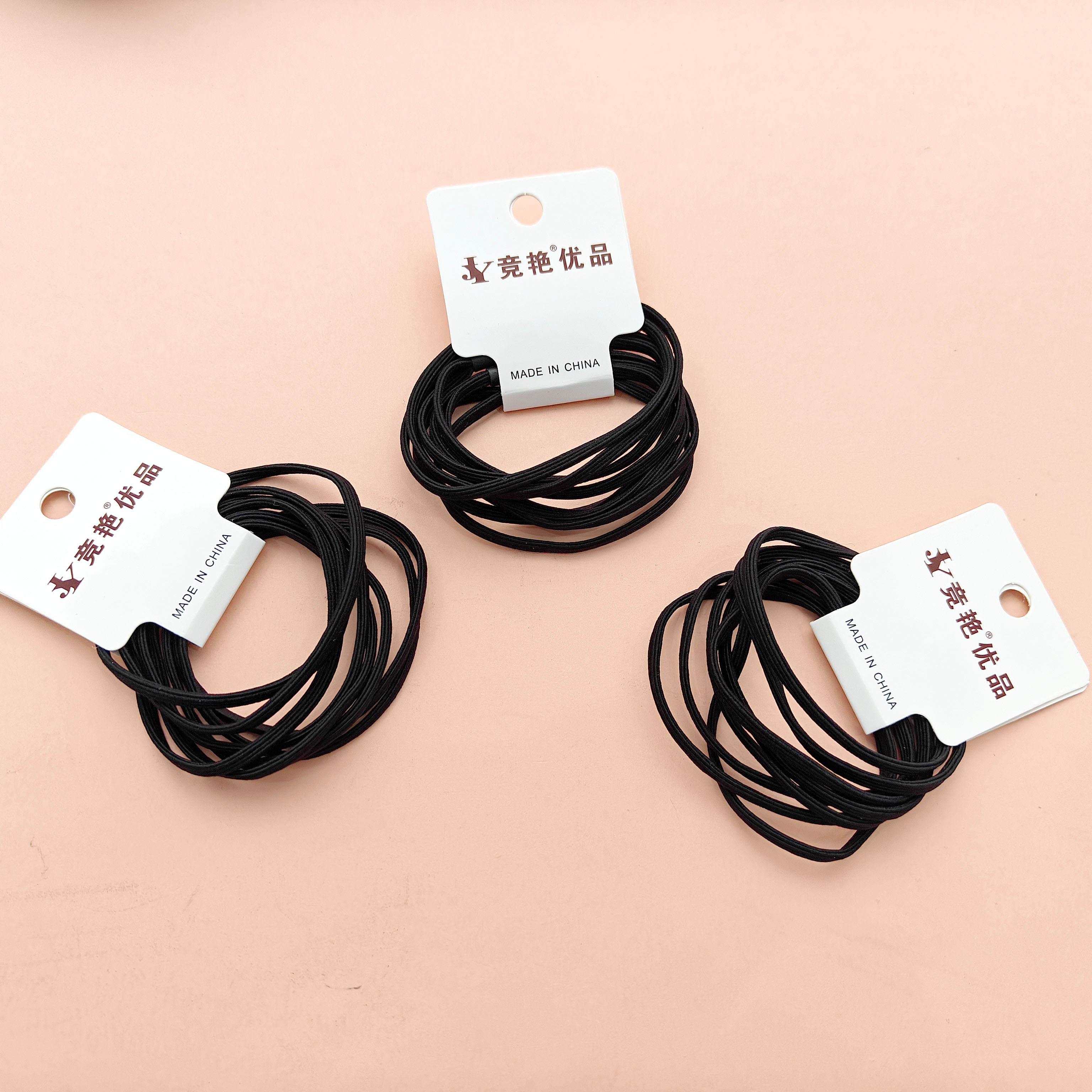 4 pure black, non-damaging four-in-one hair ties