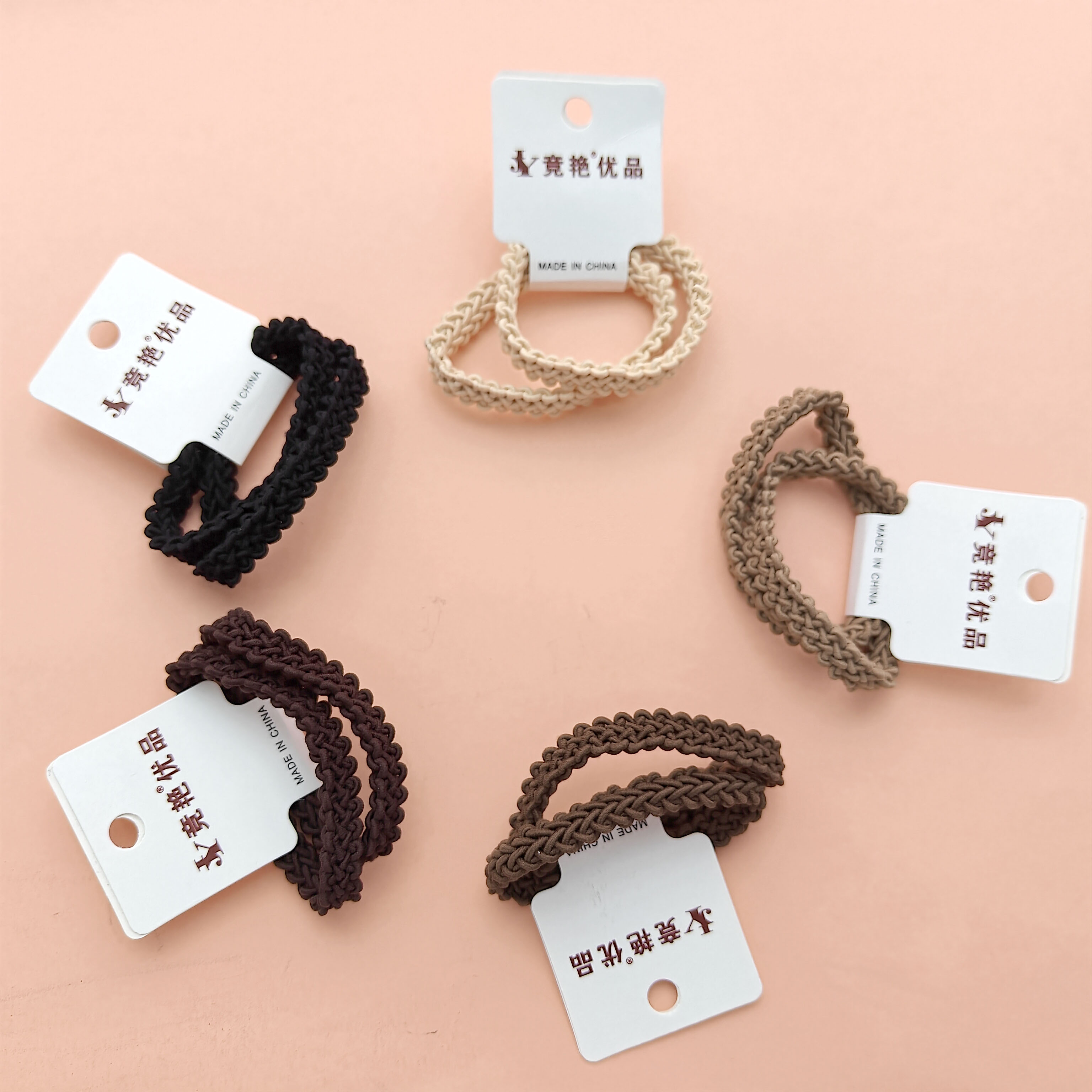 2 black-colored thick braided hair ties