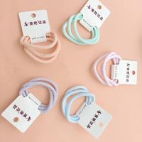 3 bold-colored fashionable hair ties decorated with candy-colored patterns