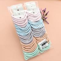 3 bold-colored fashionable hair ties decorated with candy-colored patterns