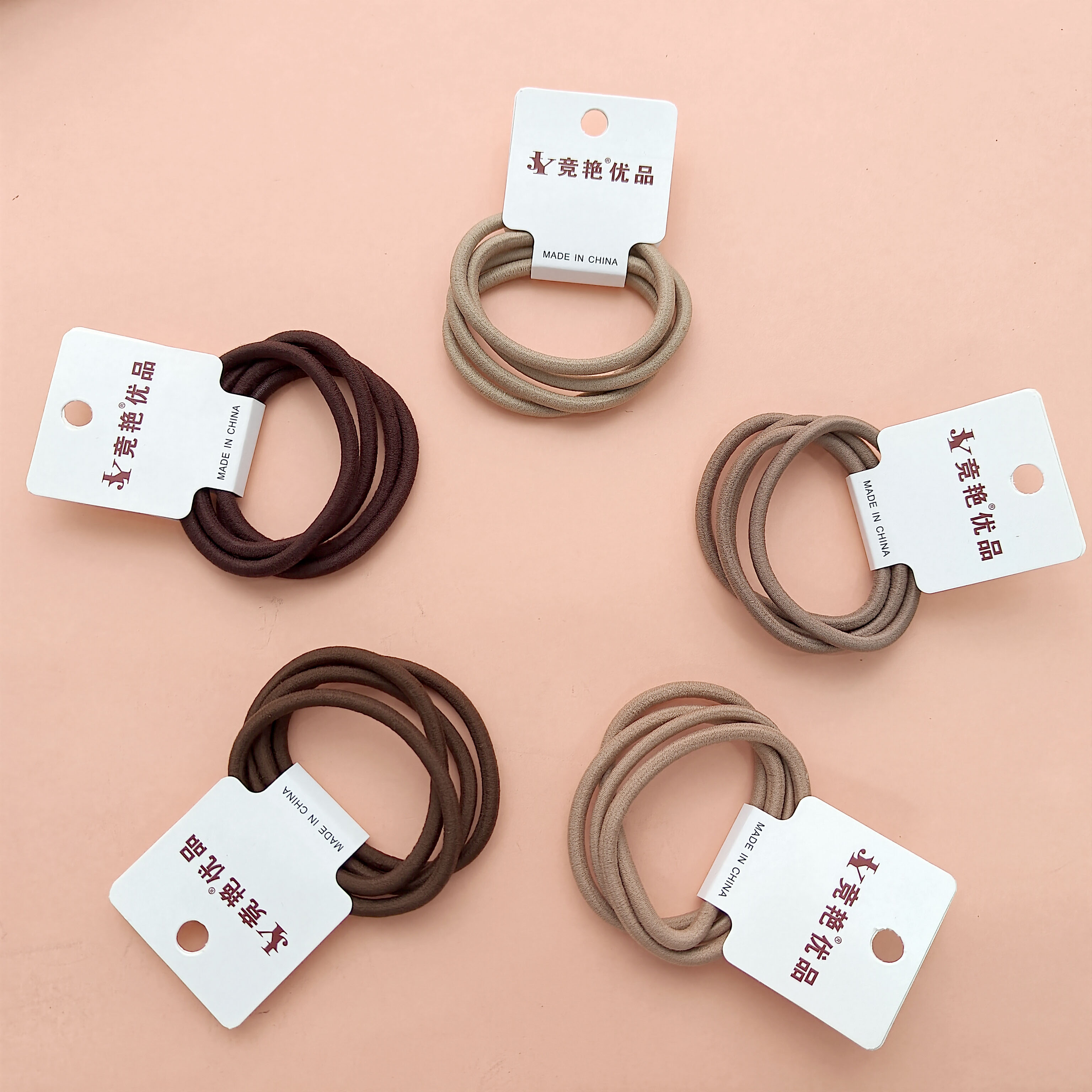4 pieces of basic hair ties decorated with earth-tone dye circles