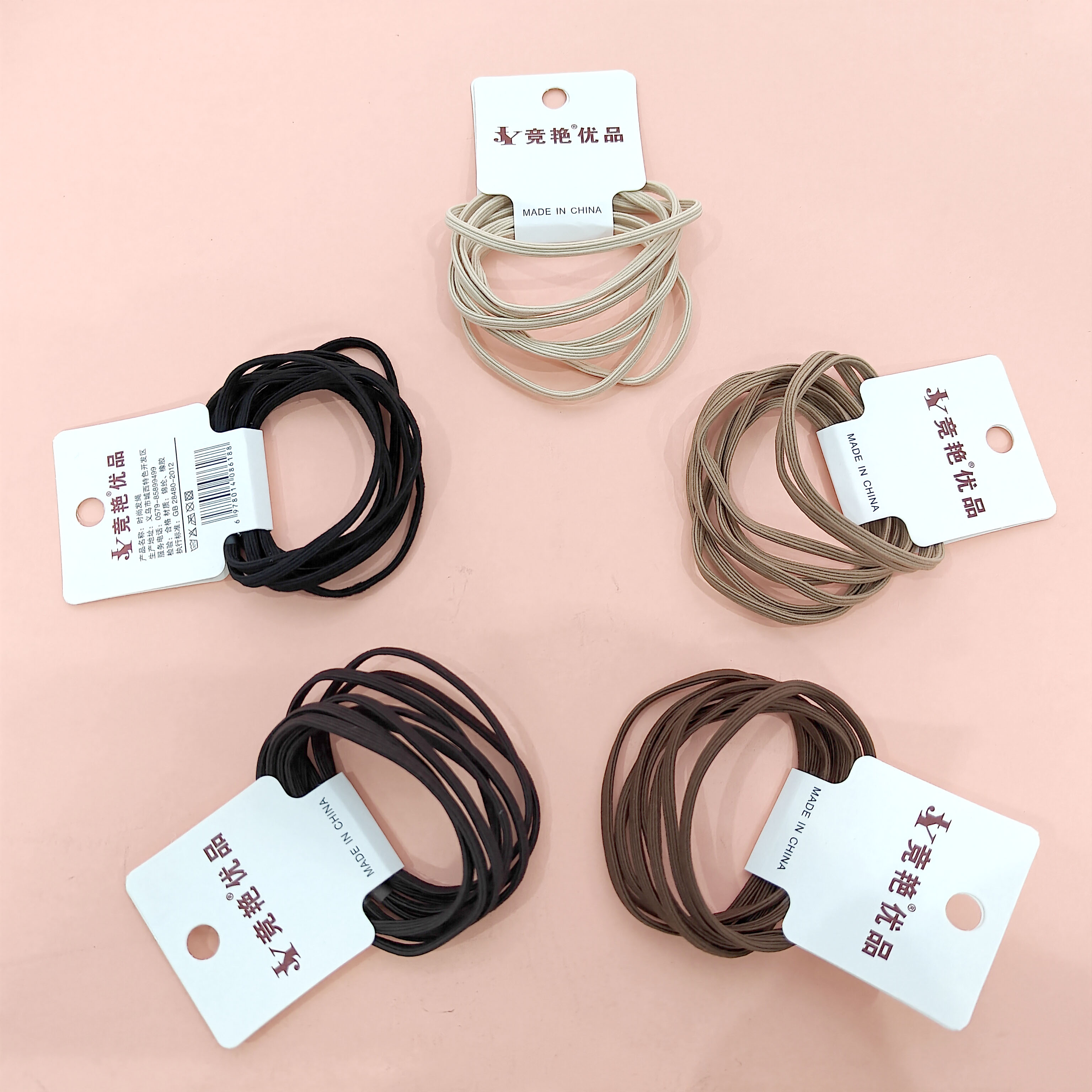 4 large-sized round elastic bands in earth tones that are very durable