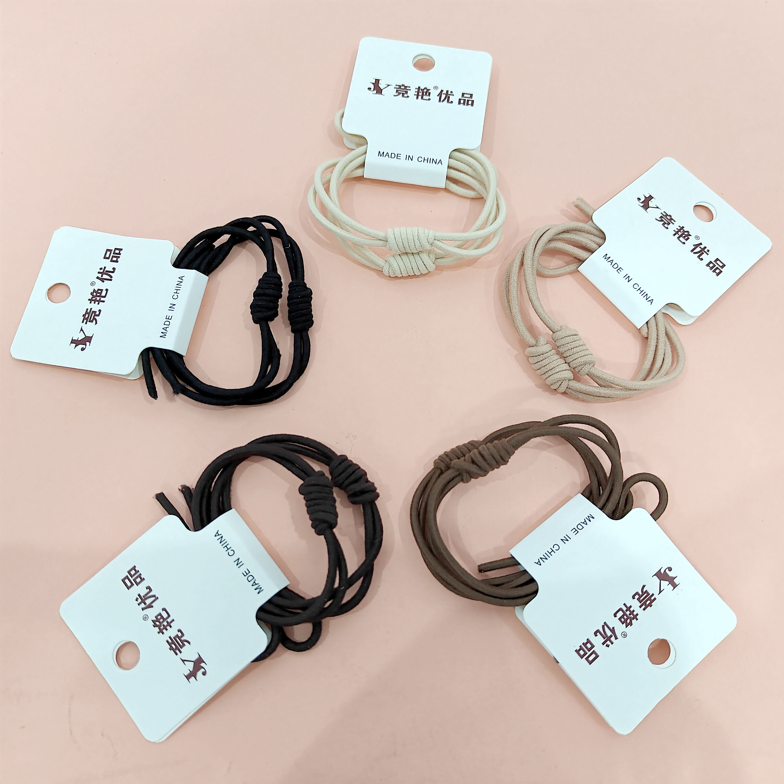 2 pieces of earth-tone bee knotted ropes